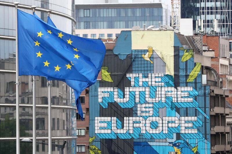 FILE PHOTO: European Union flags flutter outside the European Commission headquarters, ahead of an EU leaders summit at the European Council headquarters, in Brussels, Belgium July 16, 2020. REUTERS/Yves Herman/File Photo