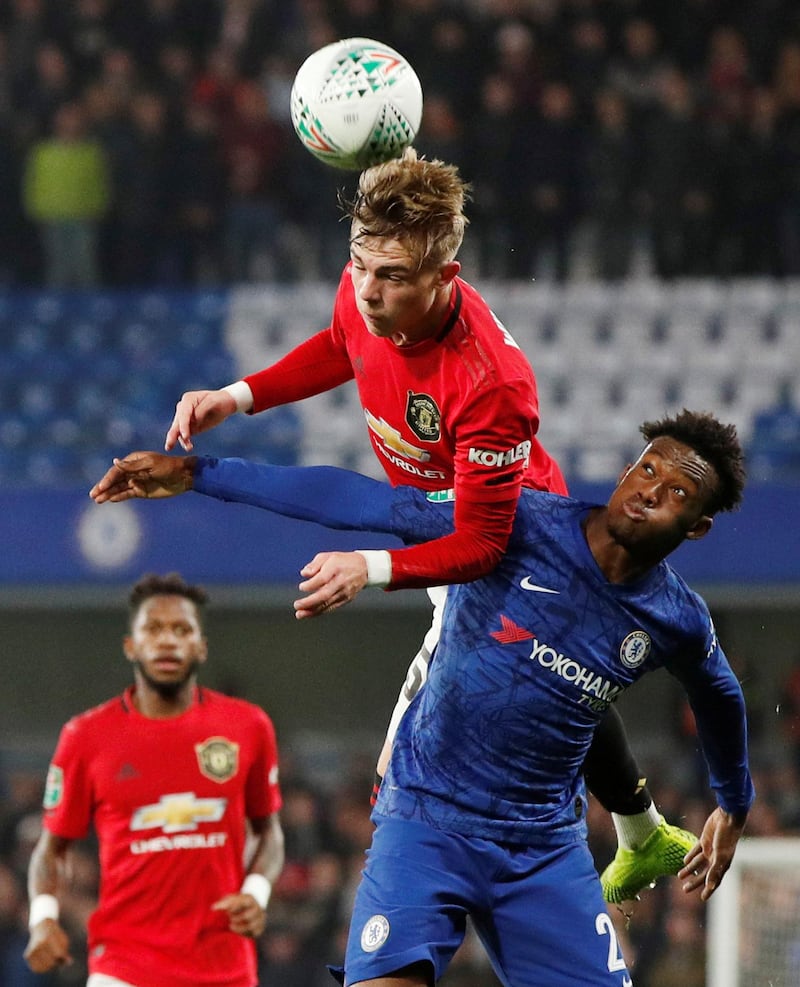 Manchester United's Brandon Williams beats Callum Hudson-Odoi of Chelsea to a header. Reuters