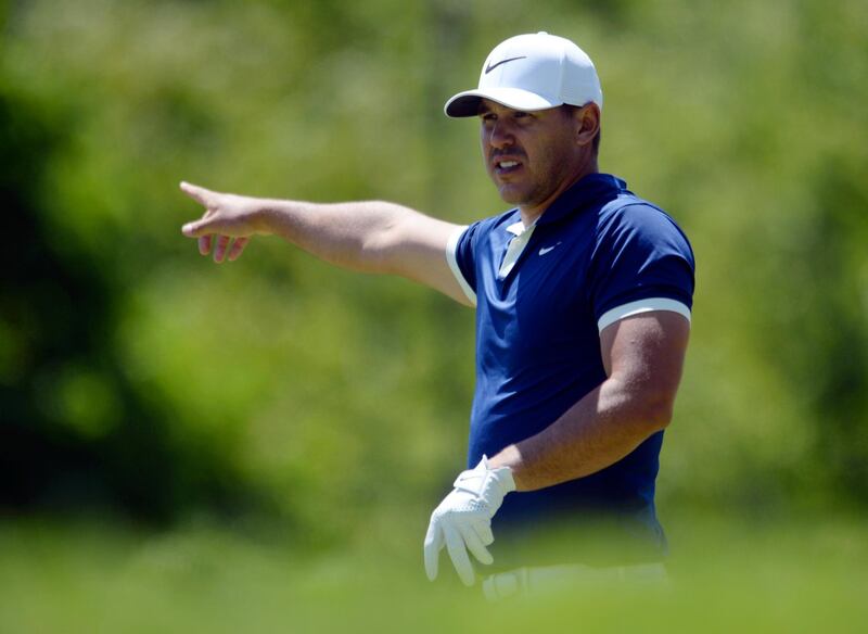 USA's Brooks Koepka signals that his drive went to the right off the ninth tee during the third round of the Canadian Open golf tournament in Ancaster, Ontario, Saturday, June 8, 2019. (Adrian Wyld/The Canadian Press via AP)