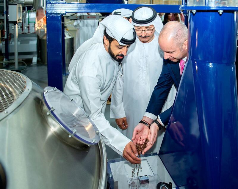 Ahmed Bin Sulayem, executive chairman of the DMCC free zone, watches as coffee beans are processed during the official launch in February 2019. Courtesy: DMCC