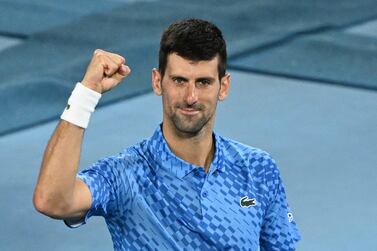 Serbia's Novak Djokovic celebrates after victory against Australia's Alex De Minaur during their men's singles match on day eight of the Australian Open tennis tournament in Melbourne on January 23, 2023.  (Photo by WILLIAM WEST  /  AFP)  /  -- IMAGE RESTRICTED TO EDITORIAL USE - STRICTLY NO COMMERCIAL USE --