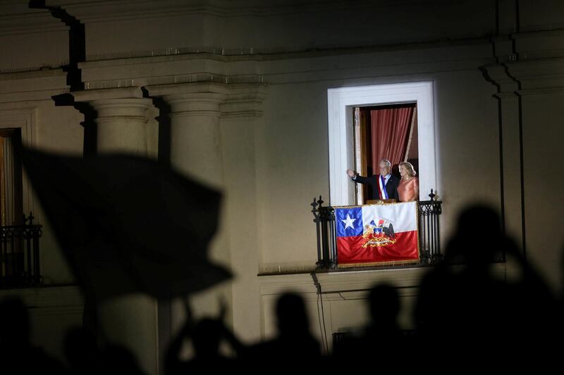 Chile's President Sebastian Pinera waves from La Moneda Presidential Palace in Santiago, Chile. Pablo Sanhueza / Reuters