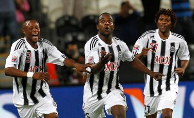 Congolese soccer club TP Mazembe soccer player Dioko Kaluyituka, center, celebrates with his teammates after scored against SC Internacional do Porto Alegre during the club world Cup semifinal soccer match at the Mohammed Bin Zayed Stadium  in Abu Dhabi, UAE, Tuesday, Dec. 14, 2010. (AP Photo/Hassan Ammar) *** Local Caption ***  HAS152_Emirates_Soccer_Club_World_Cup.jpg
