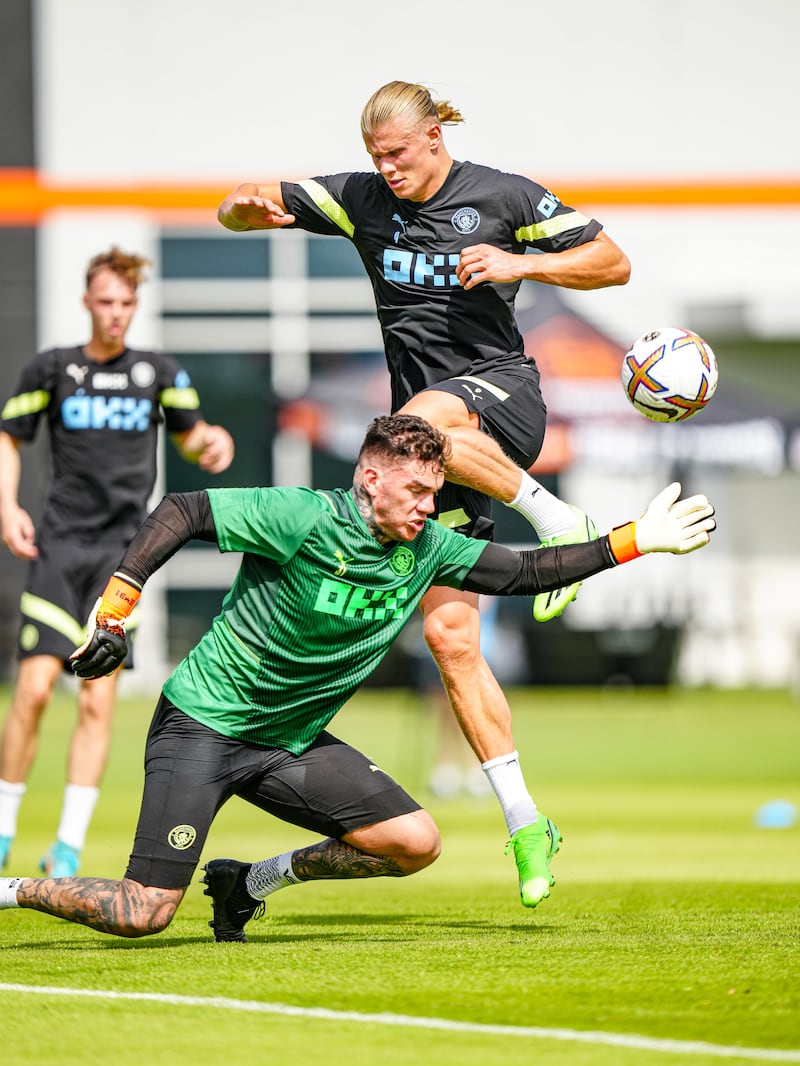 Manchester City's Erling Haaland and Ederson in action during training.