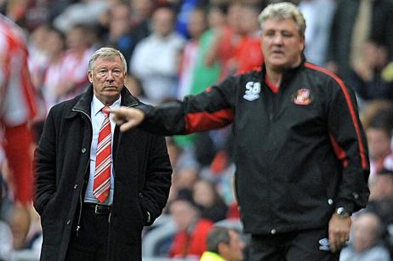 Sir Alex Ferguson, left, watches on as Steve Bruce shouts to his Sunderland players during a 0-0 home draw with United in 2017.