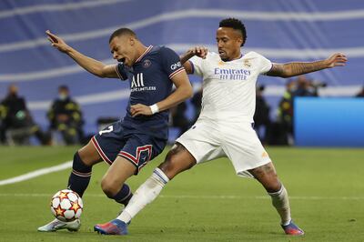 Real Madrid's Eder Militao (R) in action against Paris Saint-Germain's Kylian Mbappe (L) during the UEFA Champions League round of 16, second leg soccer match between Real Madrid and Paris Saint-Germain (PSG) in Madrid, Spain, 09 March 2022.   EPA / Sergio Perez
