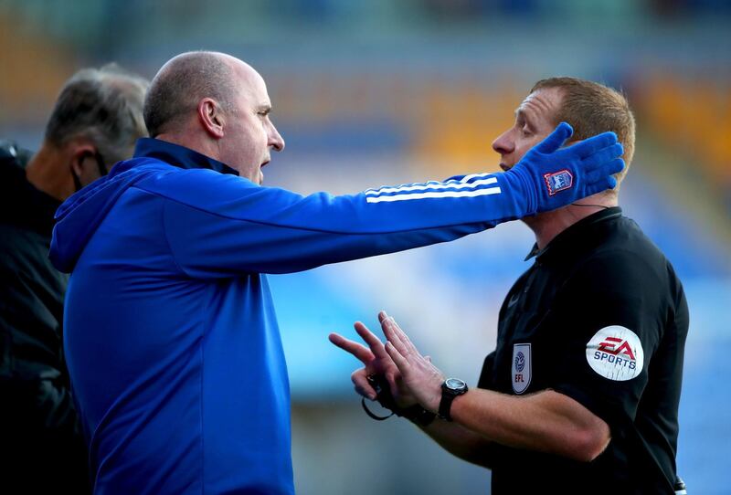 Ipswich Town manager Paul Cook, left. PA