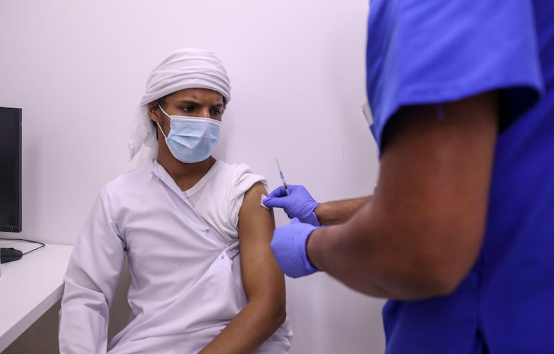 Abdullah Al Mansoori, 17, a student at Zayed University, is vaccinated before entering the army at Seha Vaccination Centre, Abu Dhabi Cruise Terminal, Zayed Port.