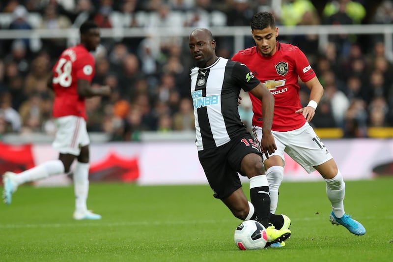 Newcastle United left-back Jetro Willems holds off Manchester United midfielder Andreas Pereira. Getty Images