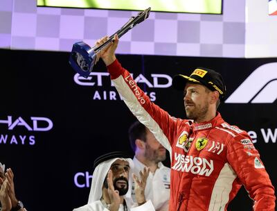 epa07189539 German Formula One driver Sebastian Vettel of Scuderia Ferrari celebrates on the podium after the Abu Dhabi Formula One Grand Prix 2018 at Yas Marina Circuit in Abu Dhabi, United Arab Emirates, 25 November 2018.  EPA/VALDRIN XHEMAJ