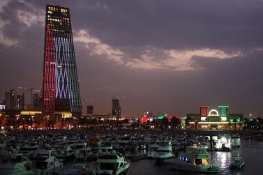 Kuwaiti buildings are illuminated in the colours of the national flag on February 20, 2021, as the country prepares to celebrate their 60th Independence Day and the 30th anniversary of the end of the Gulf war with the liberation of Kuwait from Iraqi occupation.  AFP 