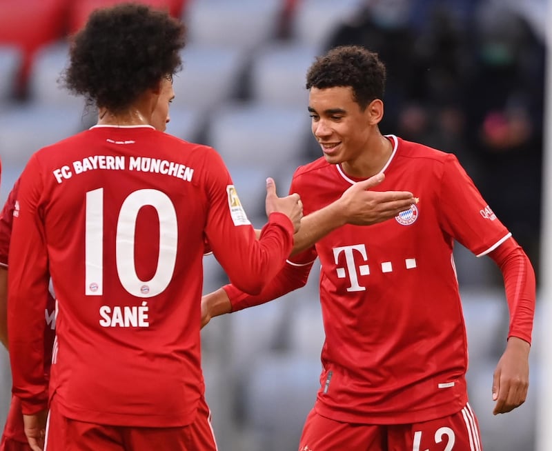 Bayern's Jamal Musiala (R) celebrates scoring the fifth. EPA