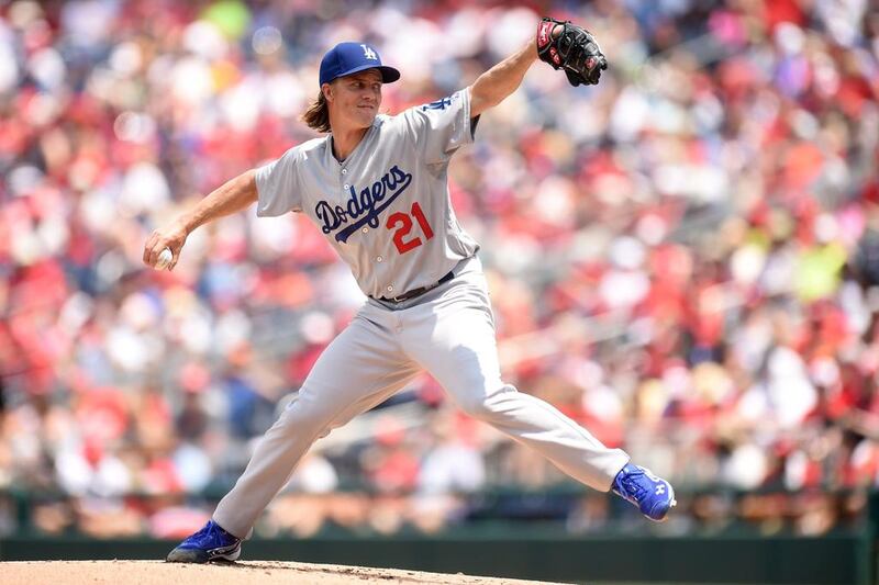 The Dodgers' Zack Greinke does not say much and prefers to let his right arm do all his talking. In that regard, that right arm has been mighty loud in keeping opponent's bats silent.   Mitchell Layton / AFP