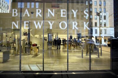 Employees put the finishing touches on the new Barney's New York retail store in New York, U.S., on Thursday, Feb. 18, 2016. With the return of Barneys New York to its original home in New York’s Chelsea neighborhood, the chairman of the store’s landlord said he’s considering a pause in purchases of similar properties in Manhattan. Photographer: Victor J. Blue/Bloomberg