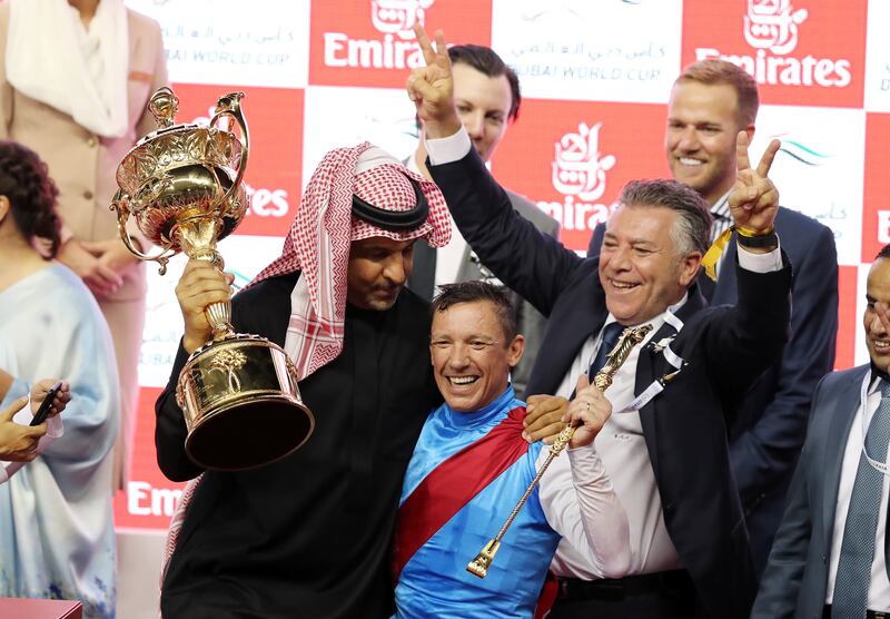 Frankie Dettori celebrates after winning the Dubai World Cup on Country Grammer. Chris Whiteoak / The National