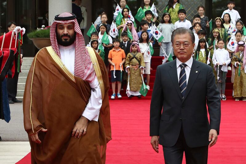 South Korean President Moon Jae-In, right, and Saudi Crown Prince Mohammed bin Salman walk to view an honour guard during a welcoming ceremony at the presidential Blue House. AP Photo