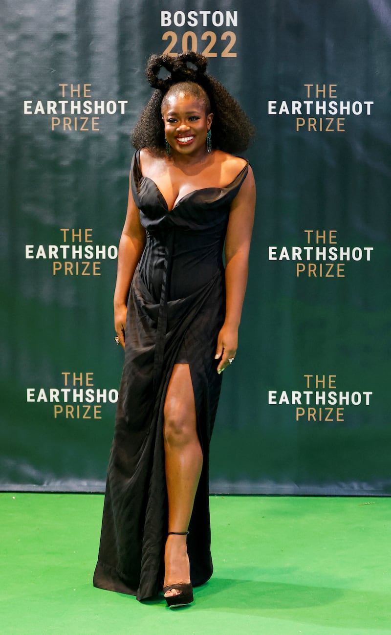 Presenter and broadcaster Clara Amfo strikes a pose on the green carpet. Reuters