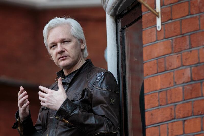Julian Assange speaks to the media from the balcony of the embassy of Ecuador in London. (Photo by Jack Taylor/Getty Images)