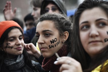 Women with "No Salvini" painted on their cheeks take part in a demonstration by anti-racism and anti-fascist groups in Milan on May 18, 2019. AFP 