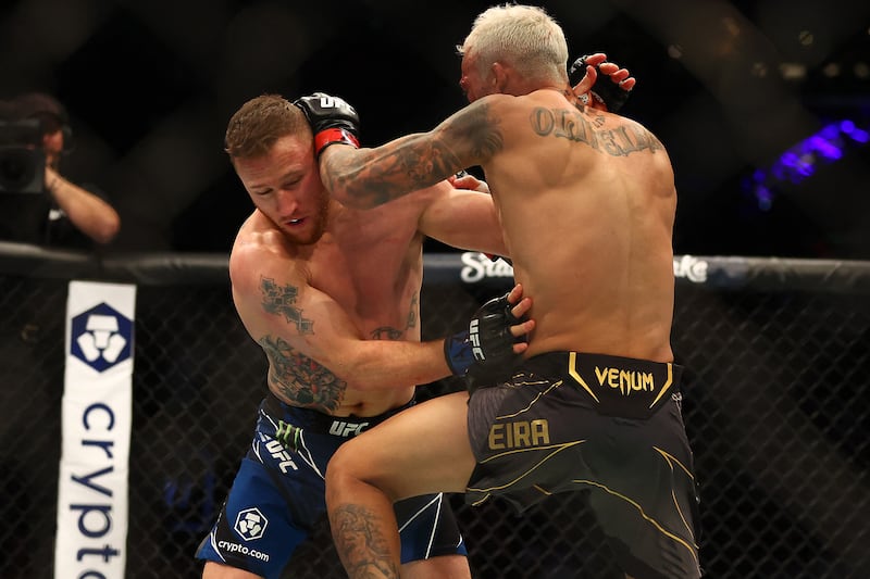Charles Oliveira and Justin Gaethje fight during their lightweight bout at UFC 274. Reuters