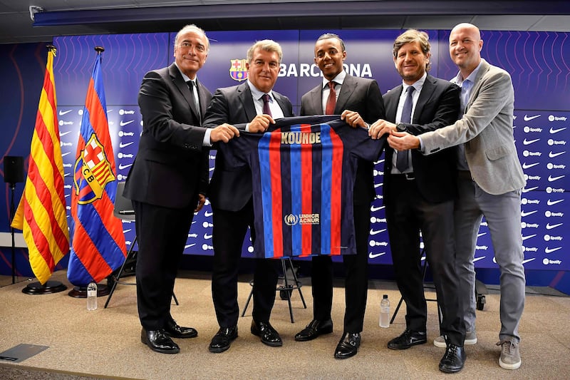 Barcelona's vice president Rafael Yuste, president Joan Laporta, new defender Jules Kounde, sports director Mateu Alemany and sporting advisor Jordi Cruyff. AFP