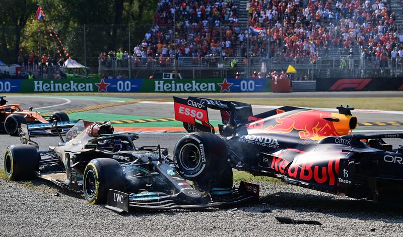 Lewis Hamilton collides with Red Bull's driver Max Verstappen. AFP