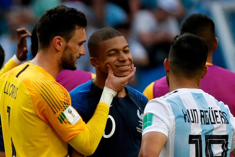 epa06852503 Goalkeeper Hugo Lloris of France (L) and Kylian Mbappe of France (C) react after the FIFA World Cup 2018 round of 16 soccer match between France and Argentina in Kazan, Russia, 30 June 2018.

(RESTRICTIONS APPLY: Editorial Use Only, not used in association with any commercial entity - Images must not be used in any form of alert service or push service of any kind including via mobile alert services, downloads to mobile devices or MMS messaging - Images must appear as still images and must not emulate match action video footage - No alteration is made to, and no text or image is superimposed over, any published image which: (a) intentionally obscures or removes a sponsor identification image; or (b) adds or overlays the commercial identification of any third party which is not officially associated with the FIFA World Cup)  EPA/YURI KOCHETKOV   EDITORIAL USE ONLY  EPA-EFE/YURI KOCHETKOV   EDITORIAL USE ONLY  EDITORIAL USE ONLY