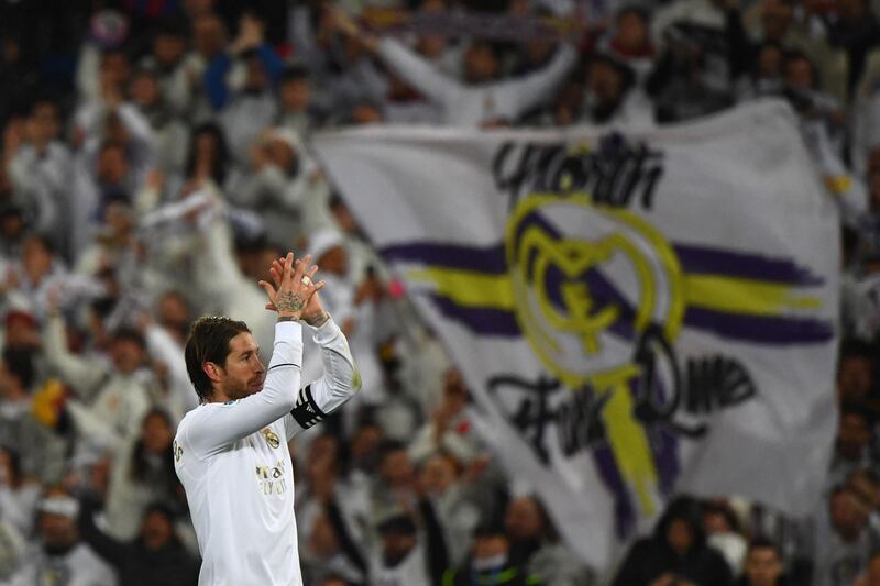 Real Madrid's Spanish defender Sergio Ramos celebrates with fans. AFP