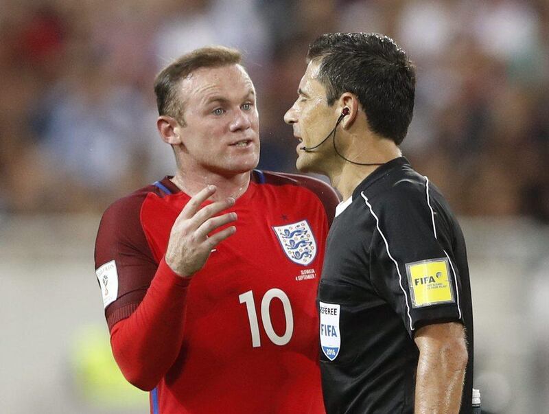 England's Wayne Rooney remonstrates with referee Milorad Mazic. Carl Recine / Reuters