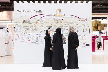 A group of young Emirati women attend a careers fair in Dubai. Reem Mohammed / The National