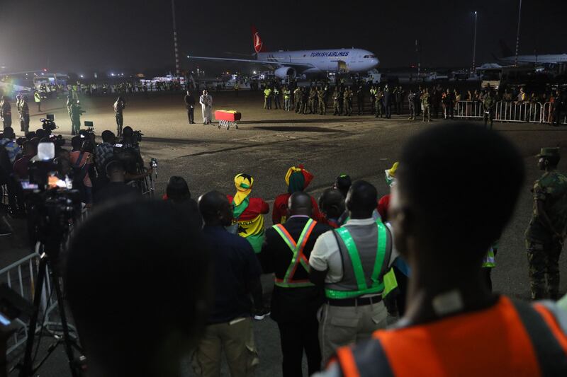 The coffin containing the remains of former Ghana international football player Christian Atsu arrive at Kotoka International Airport in Accra, Ghana, on February 19, 2023. AFP