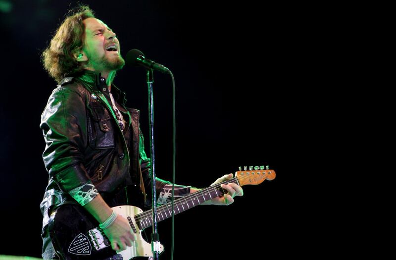 FILE--In this Nov. 3, 2011, file photo, Pearl Jam's lead vocalist Eddie Vedder performs in concert in Sao Paulo, Brazil. Republicans are condemning a poster by Pearl Jam that shows the White House in flames and a bald eagle pecking at a skeleton they say is meant to depict President Donald Trump. (AP Photo/Andre Penner, file)