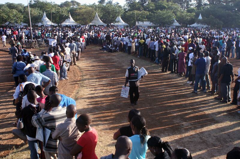  Kenyans line up  early  in the morning for voting in a general election in Kisumu, west of Nairobi, Kenya , Monday, March 4, 2013. Five years after more than 1,000 people were killed in election-related violence, Kenyans went to the polls on Monday to begin casting votes in a nationwide election seen as the country's most important - and complicated - in its 50-year history.(AP Photo/James Keyi)