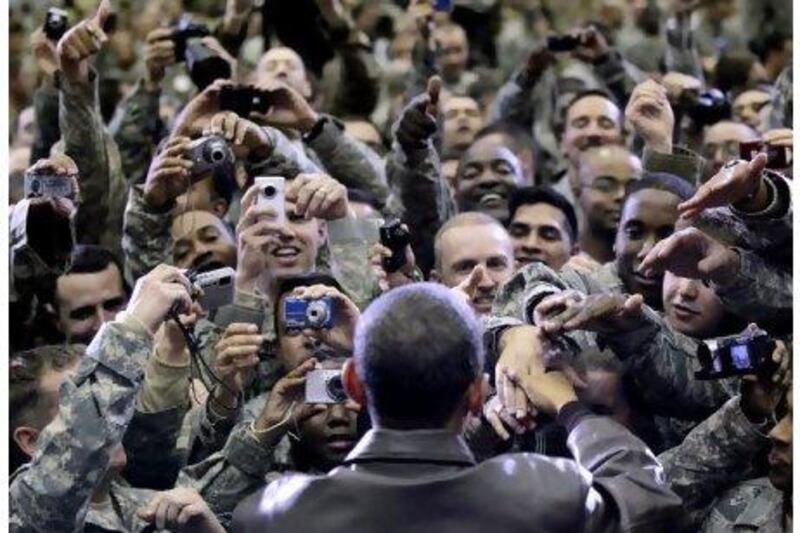 Barack Obama at Bagram airfield in Afghanistan last December. The US president will outline troops withdrawal plans today. Pablo Martinez Monsivais / AP Photo