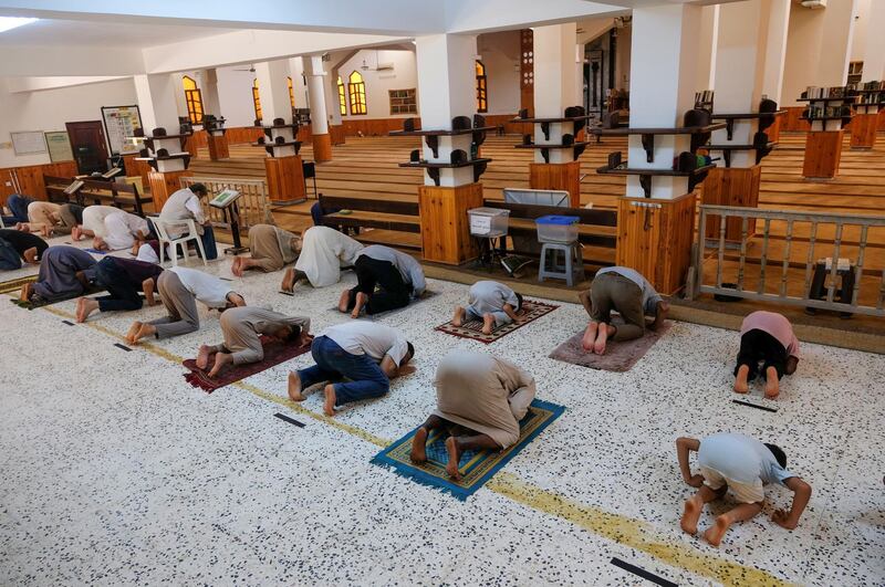 People pray as they maintain social distancing at a mosque following the outbreak of the coronavirus disease, in Benghazi, Libya. Reuters