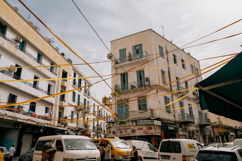 Red and gold streamers over the streets in Bab Souika on game day. Erin Clare Brown/ The National