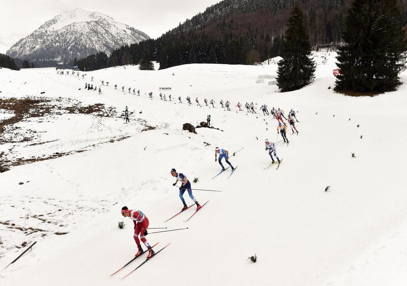 Cross-country skiers pass in line at the mass start of the men's 50-kilometre race, at the FIS Nordic World Ski Championships in Oberstdorf, southern Germany. AFP