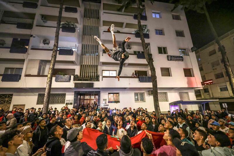 Morocco supporters in Rabat celebrate after their country's World Cup win over Portugal. AFP
