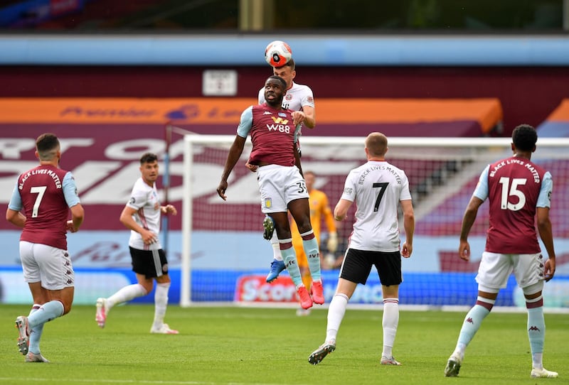 Aston Villa's Keinan Davis jumps for a header on Wednesday. AFP