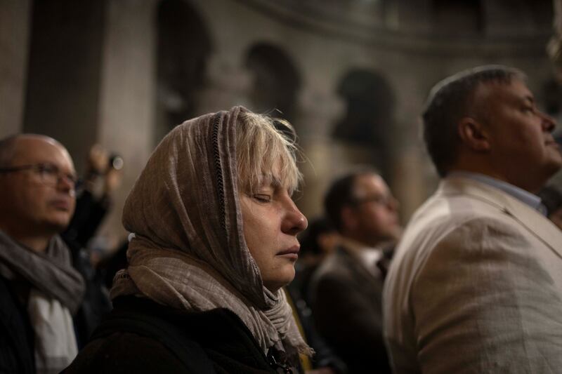 Devotees attend Palm Sunday mass in the Church of the Holy Sepulchre, where many Christians believe Jesus was crucified, buried and rose from the dead, in the Old City of Jerusalem. AP