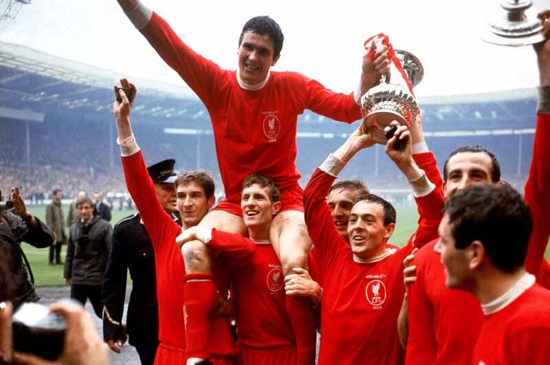 Liverpool captain Ron Yeats, top, after winning the FA Cup in 1965, celebrates with teammates (left to right) Geoff Strong, Wilf Stevenson, Peter Thompson, Ian St John, Gerry Byrne and Ian Callaghan. PA