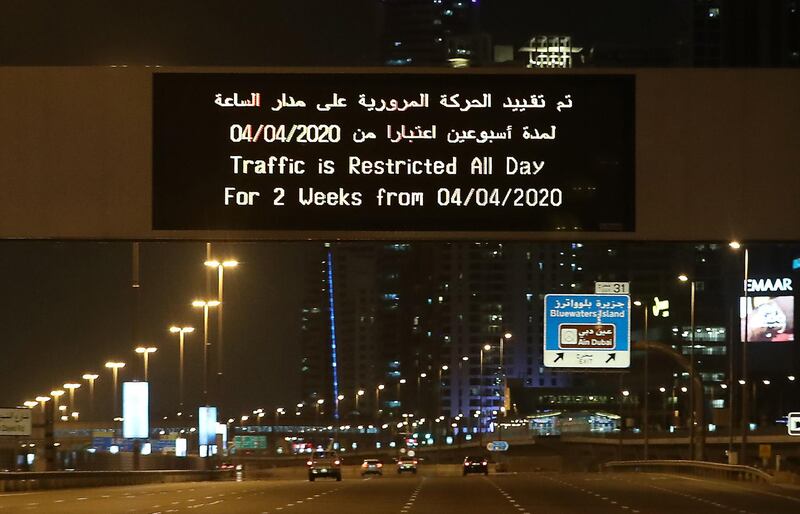 DUBAI, UNITED ARAB EMIRATES , April 05 – 2020 :- Traffic restriction message on Sheikh Zayed road in Dubai.  Dubai is conducting 24 hours sterilisation programme across all areas and communities in the Emirate and told residents to stay at home. UAE government told residents to wear face mask and gloves all the times outside the home. (Pawan Singh / The National) For News/Online/Instagram.