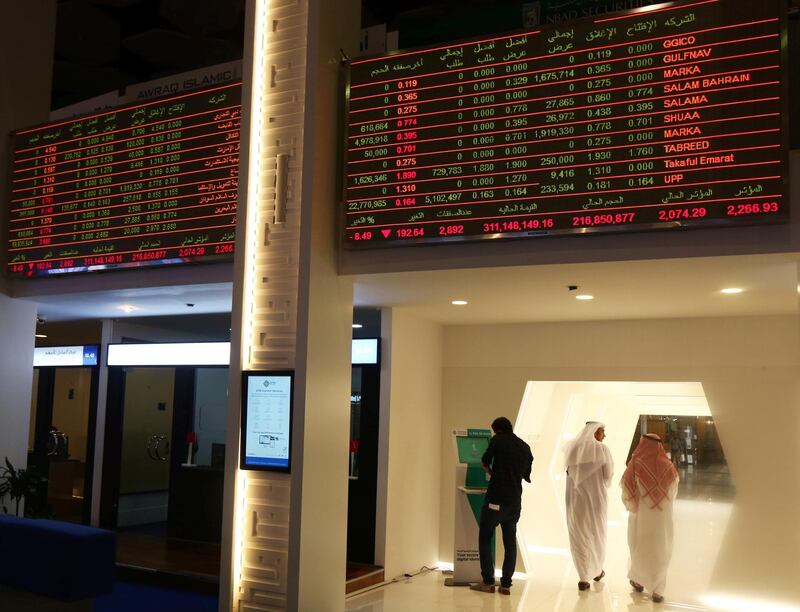 Investors are seen at the Dubai International Financial Market in Dubai, UAE. Reuters