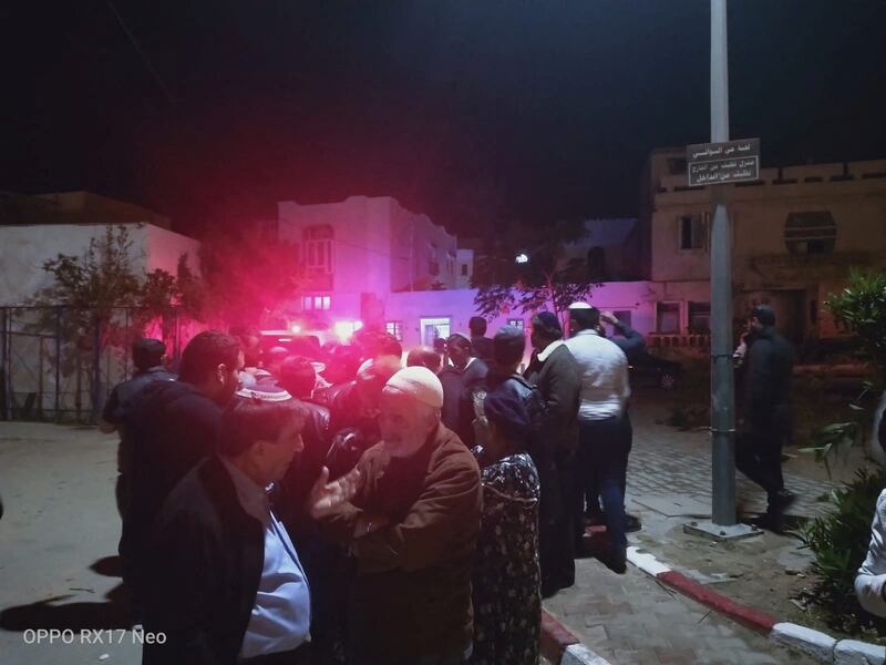 People gather near the synagogue following the gun attack. Reuters