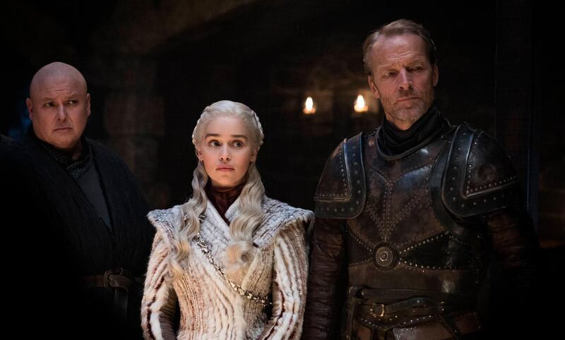 This image released by HBO shows from left Conleth Hill, Emilia Clarke, Iain Glen in a scene from "Game of Thrones," that aired Sunday, April 21, 2019. With the Game of Thrones' Jon Snow revealing his royal lineage to his potential rival Daenerys Targaryen, the beleaguered army at Winterfell is about to find out if two chief executives better than one. (Helen Sloan/HBO via AP)