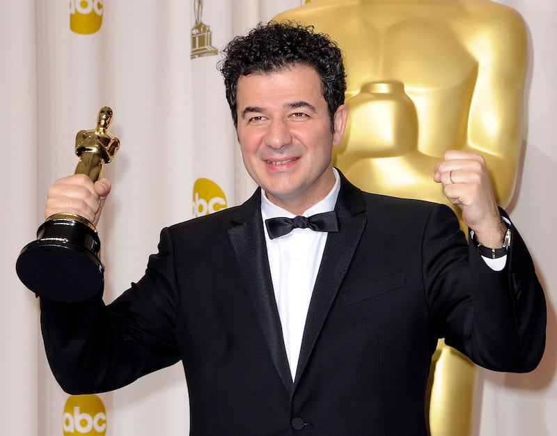 epa03124029 French composer Ludovic Bource holds his Oscar for Achievement in Music (Original Score) for 'The Artist' during the 84th annual Academy Awards at the Hollywood and Highland Center in Hollywood, California, USA, 26 February 2012. The Oscars are presented for outstanding individual or collective efforts in up to 24 categories in filmmaking.  EPA/PAUL BUCK
