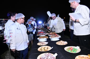 World of Food Abu Dhabi food festival served a record-breaking buffet of 2,586 desserts at Umm Al Emarat park on December 7
