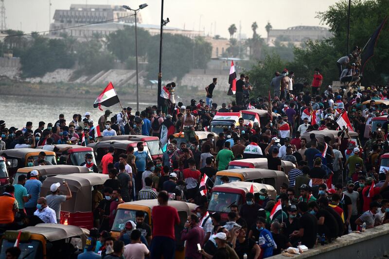 Iraqi protesters gather over the Al-Jumhuriya Bridge that leads to the headquarters of the Iraqi government inside the high security Green Zone area, during the ongoing protests in central Baghdad, Iraq. EPA