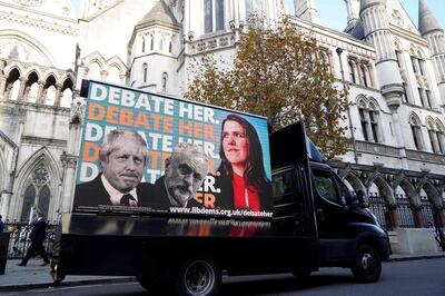 A Liberal Democrat advertising van drives past the High Court in London as the Liberal Democrats bring an action to the court after being excluded from a General Election leaders debate on November 18, 2019.                              / AFP / Niklas HALLE'N
