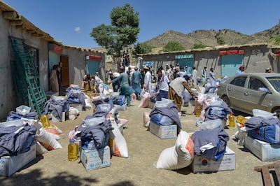 Volunteers prepare to distribute aid for earthquake victims in Gayan district, Paktika province. AFP